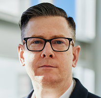 Foto di Alexander Hughes, CEO e dirigente di un'azienda di crypto trading